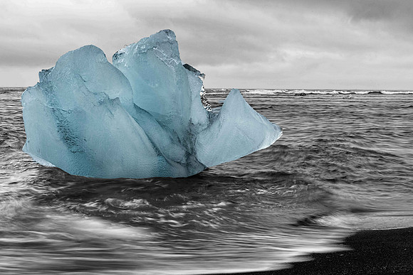 Blue Glacier Ice on Black Sand Beac