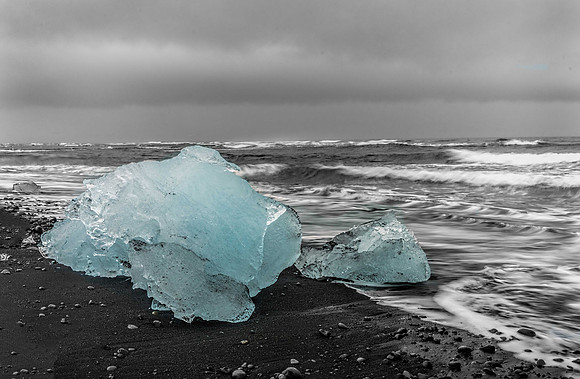 Blue Glacier Ice on Black Sand Beac